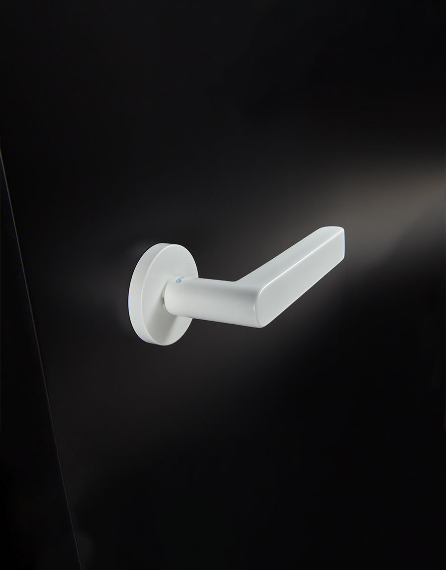 Ipnos door handle set on round rose